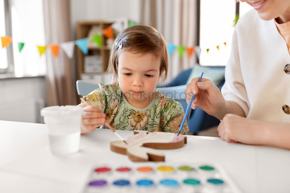 Similar – Image, Stock Photo Woman assembling furniture at home with Daughter