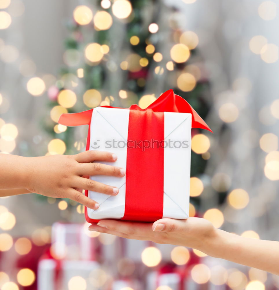 Young man holding a christmas gift