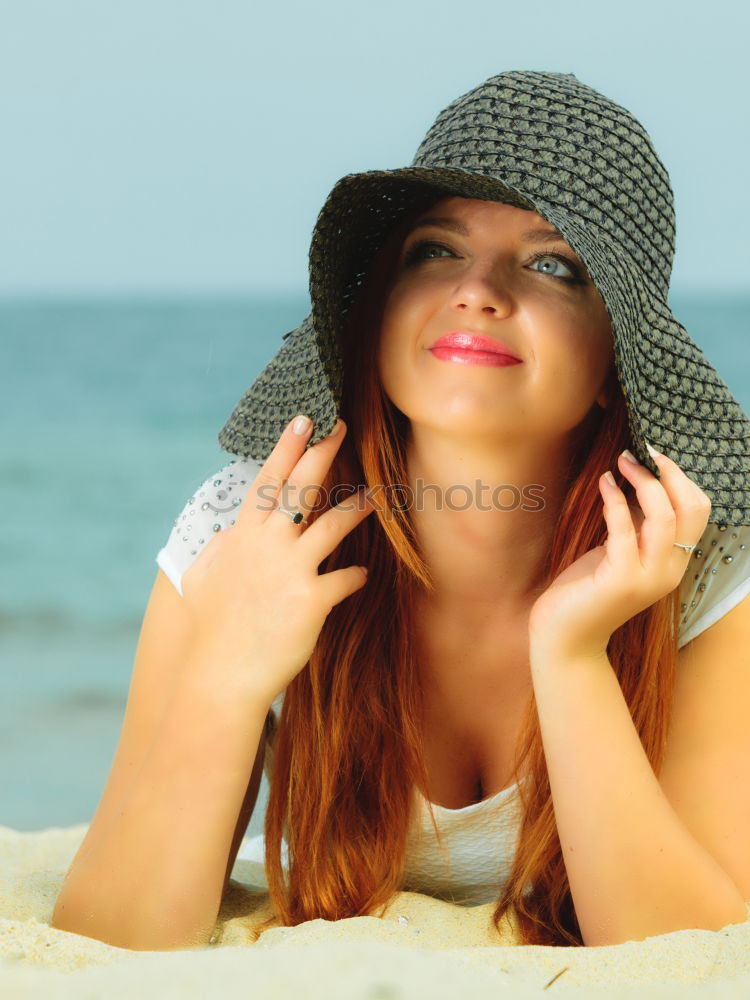 Similar – Redhead model protecting herself from sun