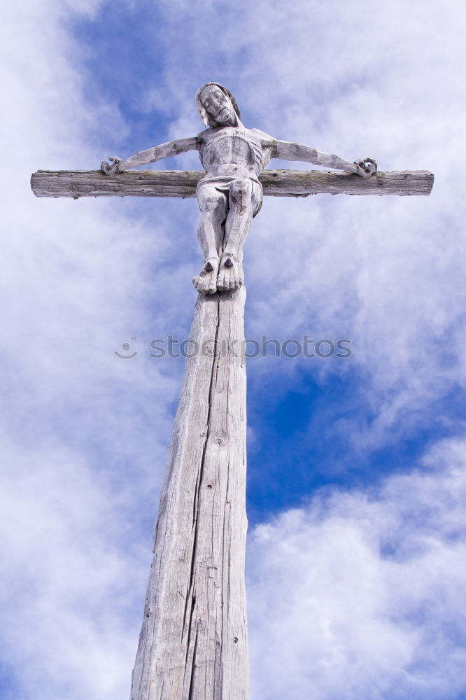 Similar – Embrace the Cross Statue