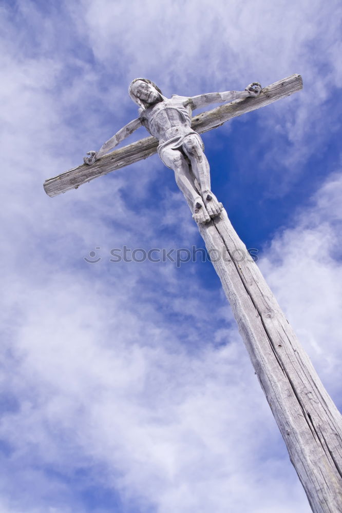 Similar – Embrace the Cross Statue