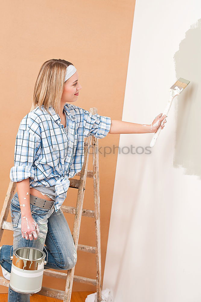 Similar – Worker with corner and pencil in hand