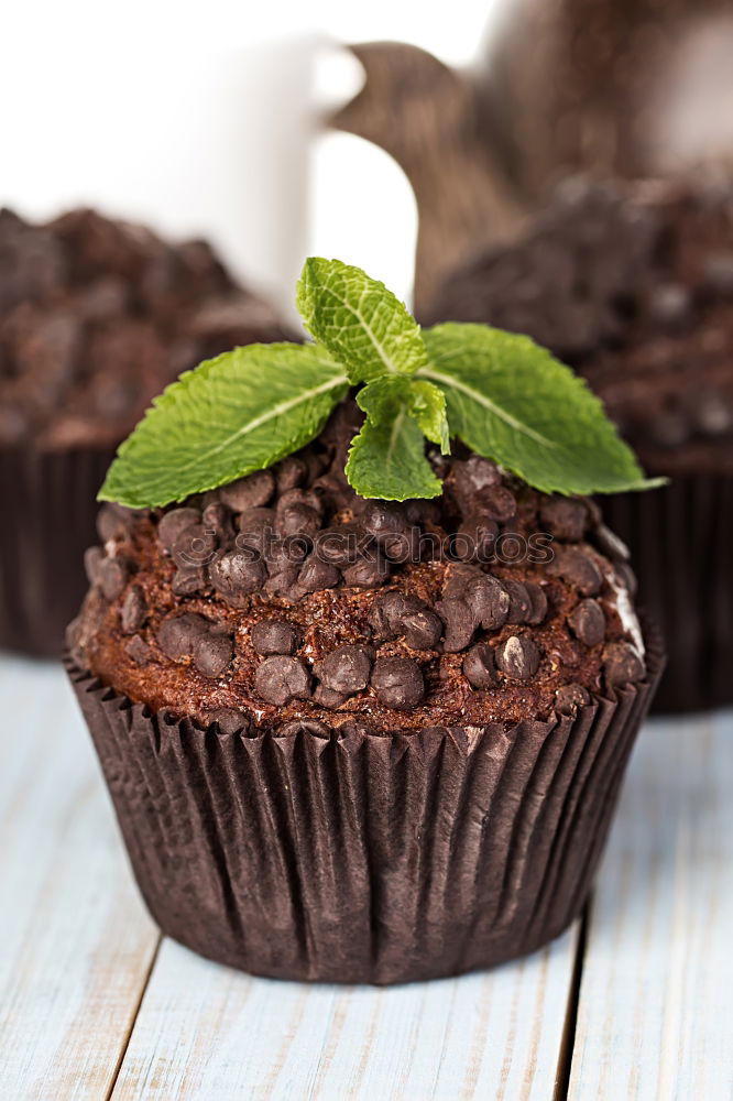 Similar – Image, Stock Photo white etagere with chocolate cake muffin and its preparation