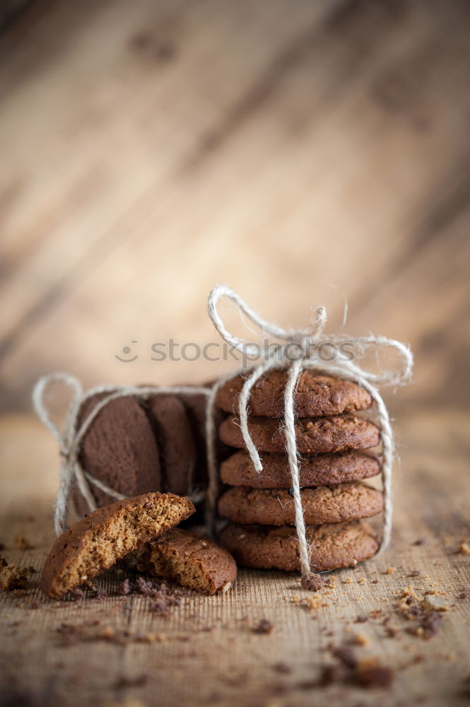 Similar – Image, Stock Photo A few gingerbread cookies wrapped in red ribbon Happy Christmas