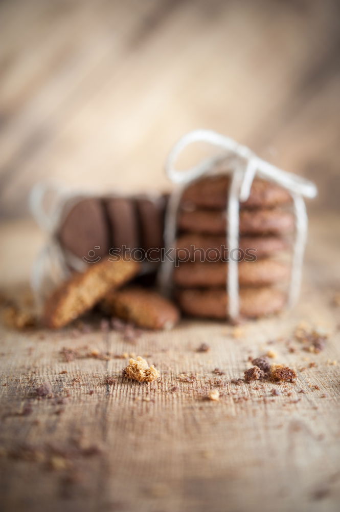 Similar – Image, Stock Photo A few gingerbread cookies wrapped in red ribbon Happy Christmas