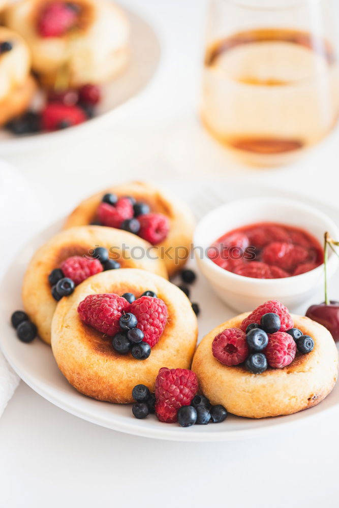 Similar – Delicious tartlets with raspberries and blueberries