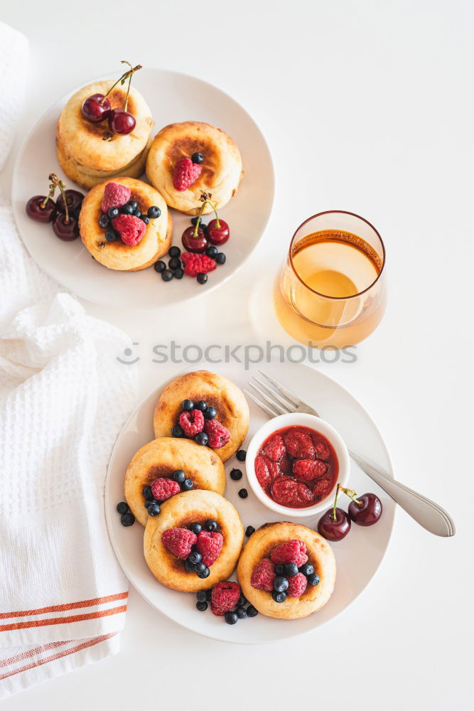 Similar – Delicious tartlets with raspberries and blueberries