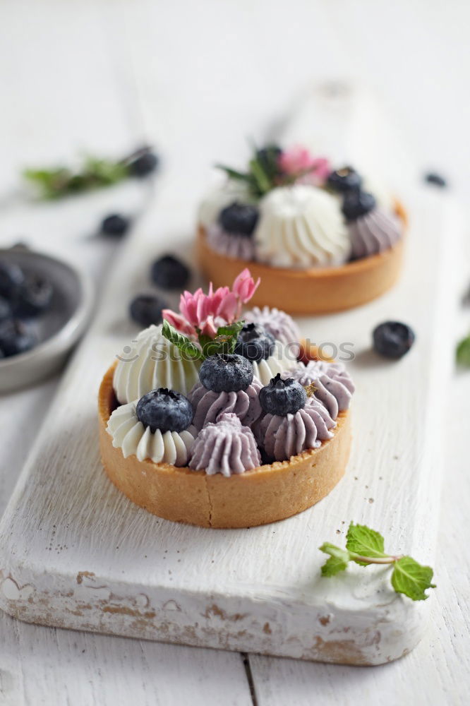 Similar – Image, Stock Photo Tartlets with blueberries and pink flowers