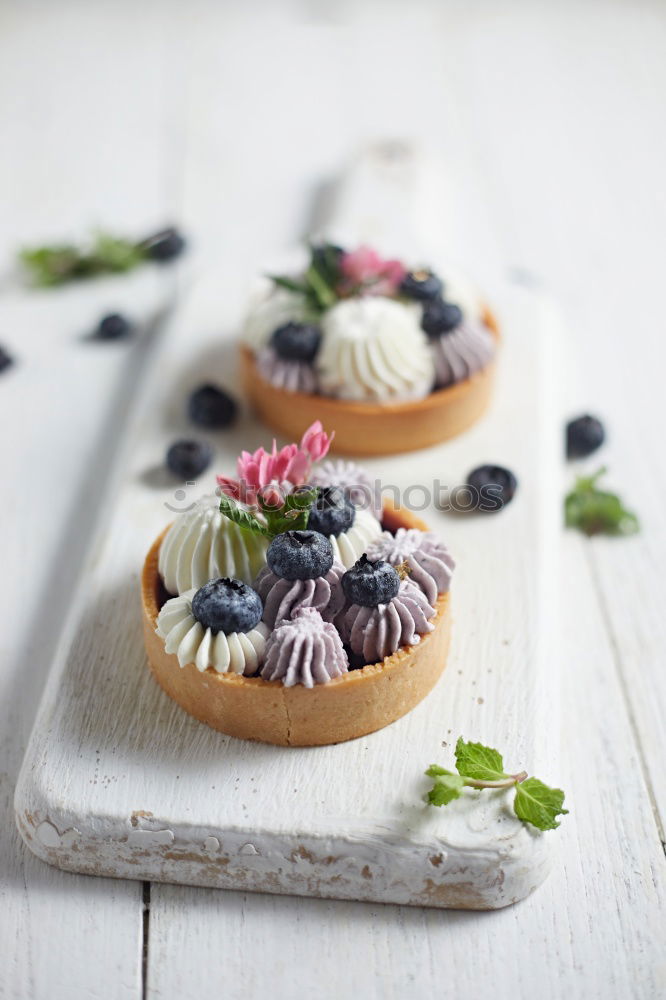 Similar – Image, Stock Photo Tartlets with blueberries and pink flowers