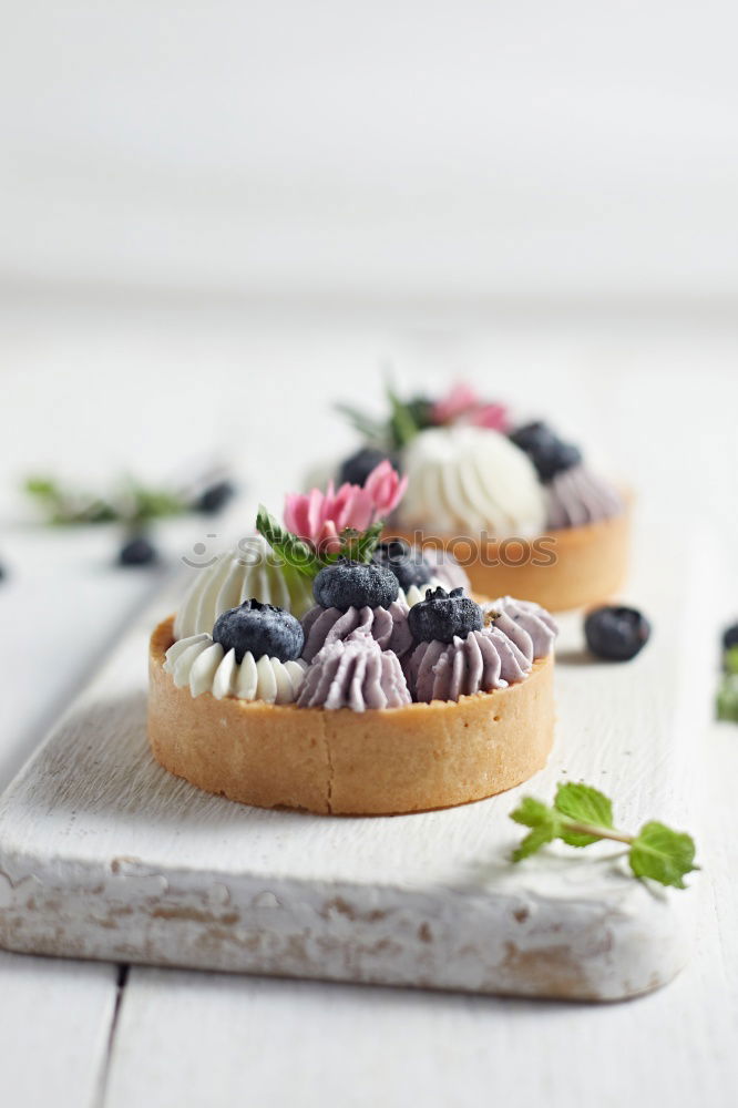 Similar – Image, Stock Photo Delicious tartlets with raspberries and blueberries