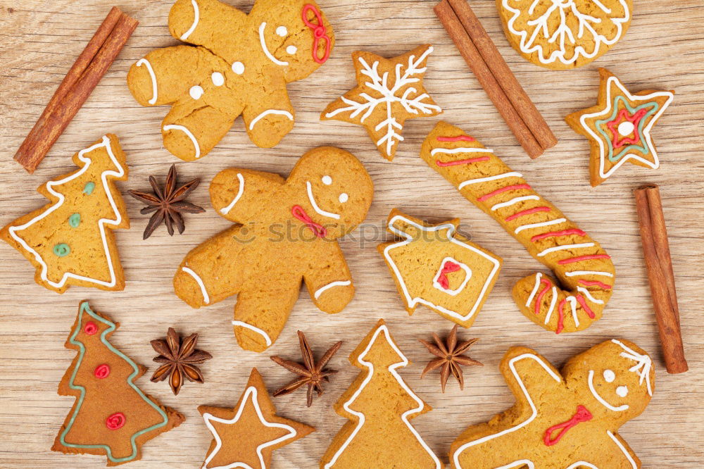 Similar – Image, Stock Photo Christmas cookies decorated with frosting on wooden board