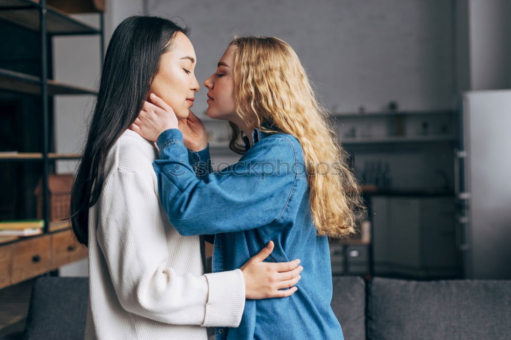 Similar – Image, Stock Photo Happy mother kissing her daughter enjoying a winter afternoon