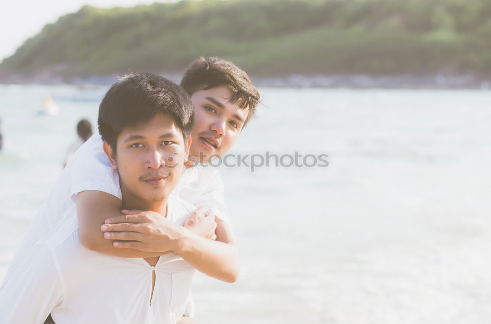 Similar – Brothers sitting at waterfront