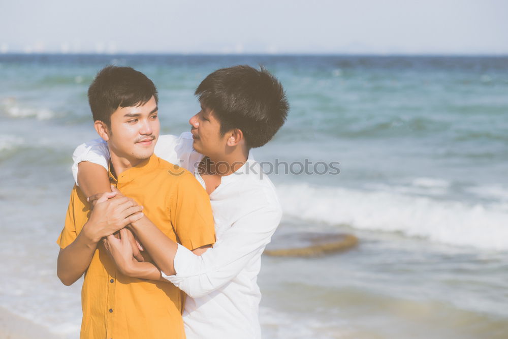 Similar – Brothers sitting at waterfront