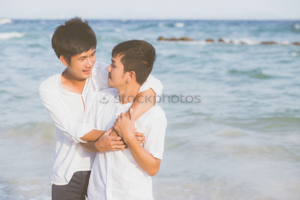 Similar – Brothers sitting at waterfront