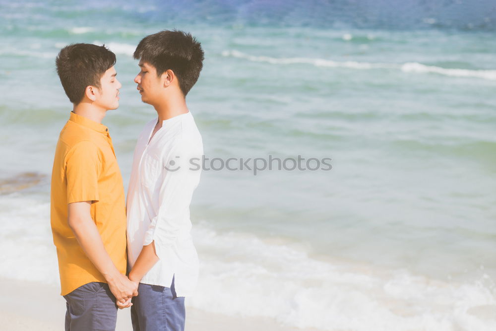 Similar – Brothers sitting at waterfront