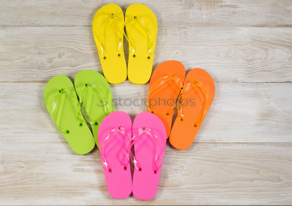 Similar – Row of wellies standing on a wooden porch while raining