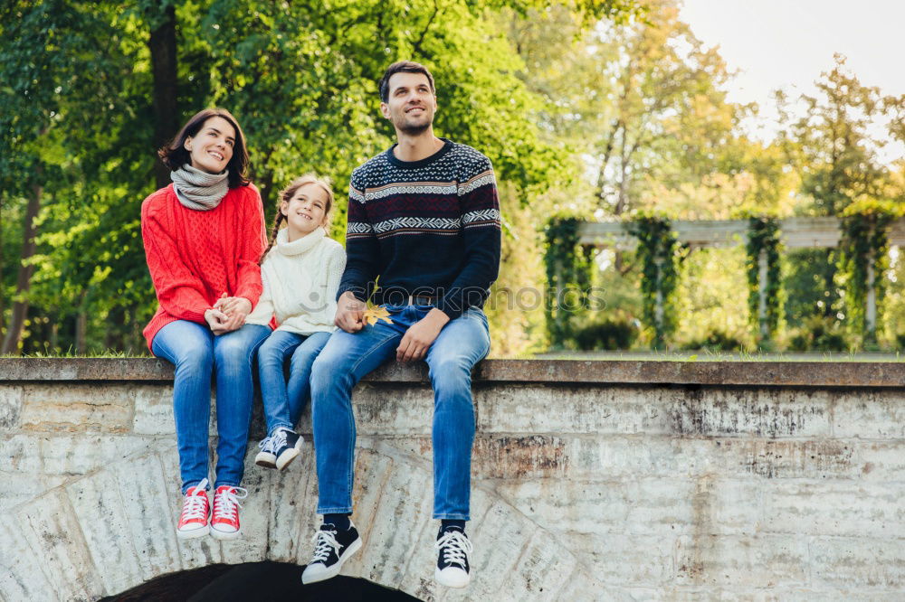 Similar – Family spending vacation time together having a snack sitting on jetty over the lake on sunny day in the summertime