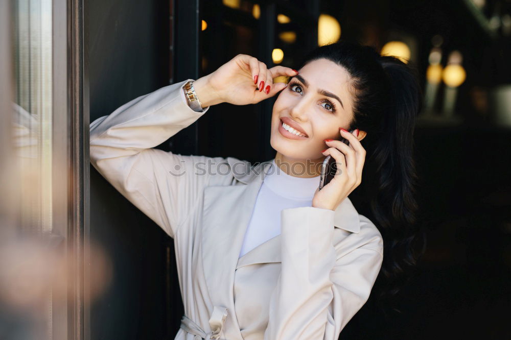 Similar – Stylish woman in jacket talking phone