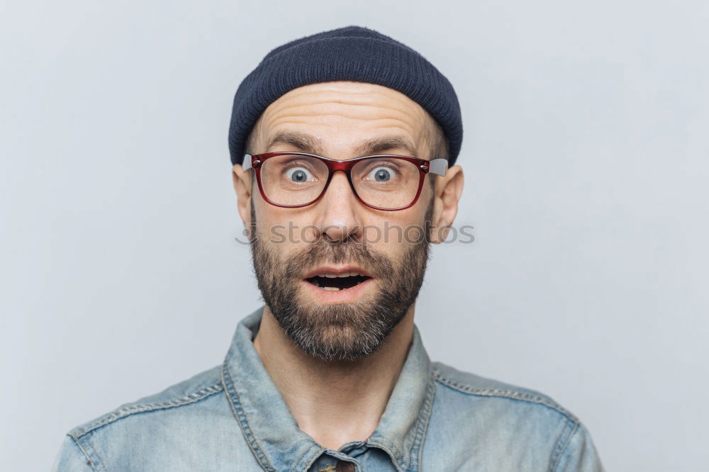 Similar – Portrait of a man with glasses and mustache with crossed arms