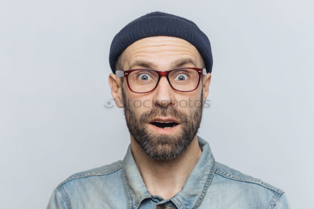 Similar – Portrait of a man with glasses and mustache with crossed arms