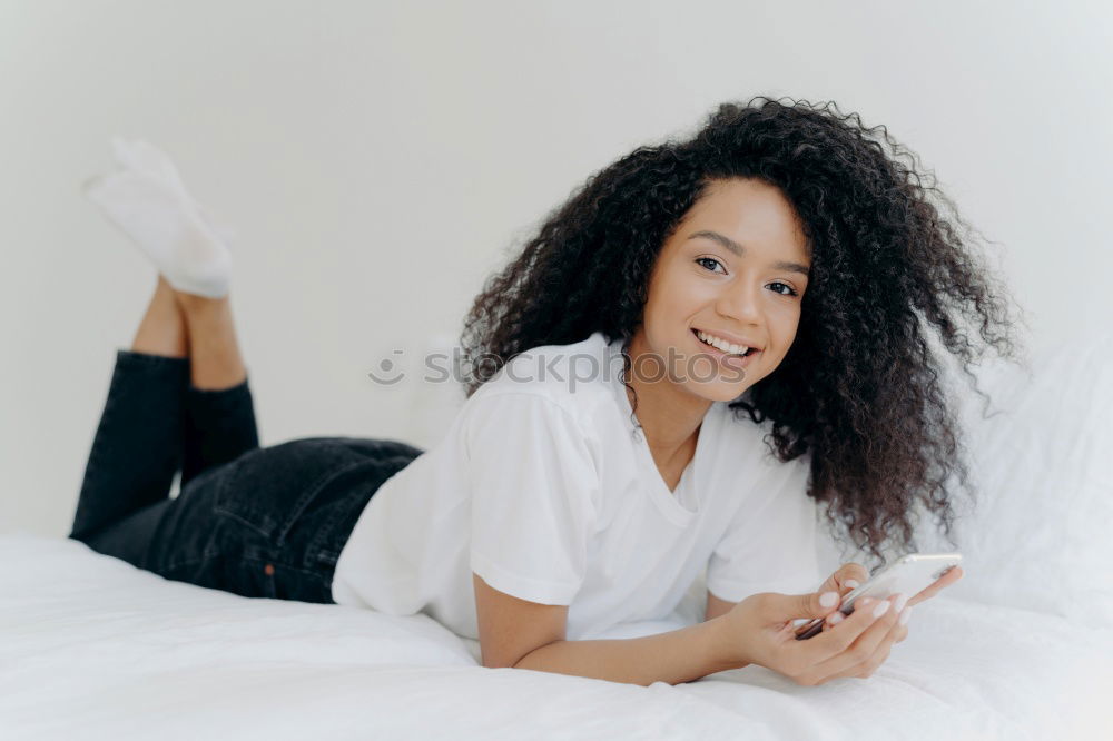 Similar – Happy beautiful young black woman relaxed sitting in the bed