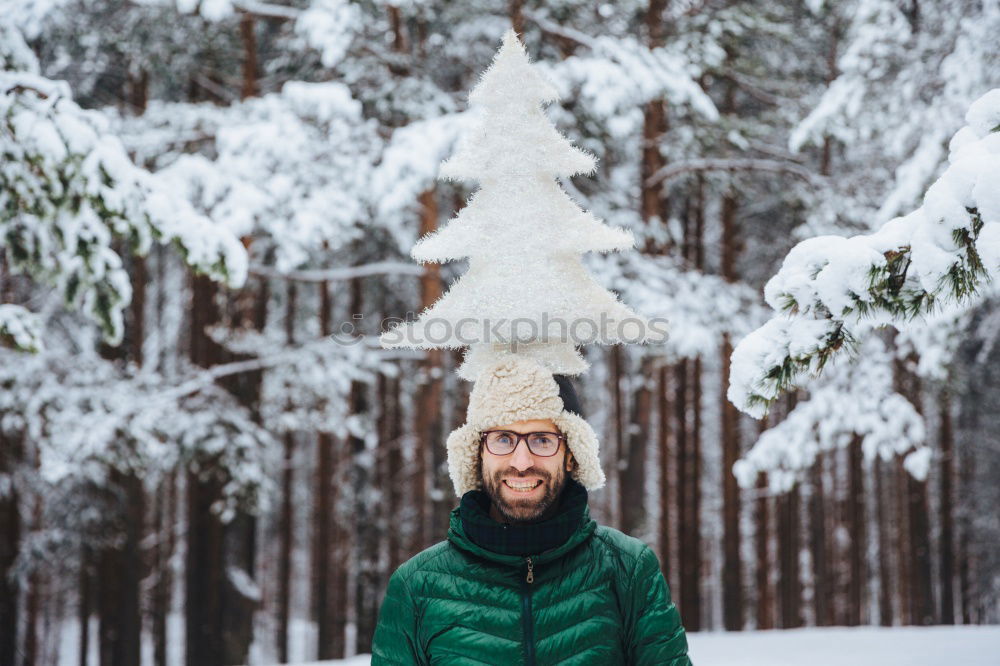 Similar – portrait Young pretty woman enjoying and playing with snow in winter