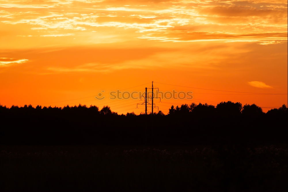 Similar – Red rising sun on top of an electric pole