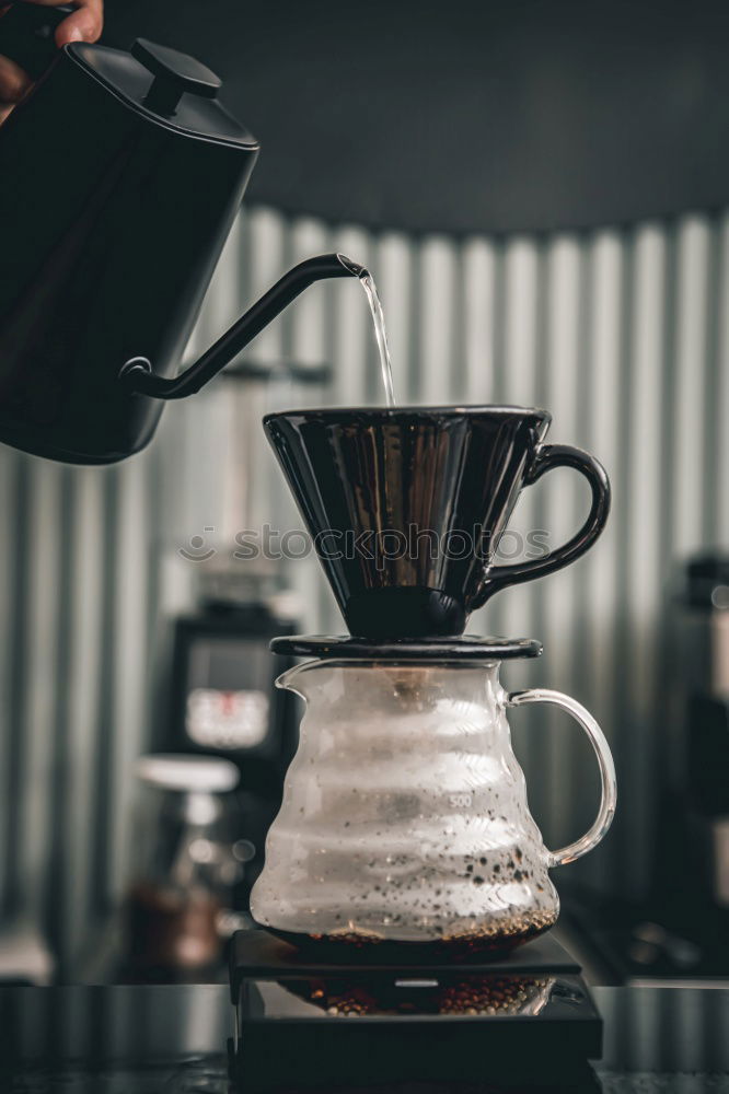 Similar – Image, Stock Photo Hand drip coffee, pouring water on coffee ground with filter drip style