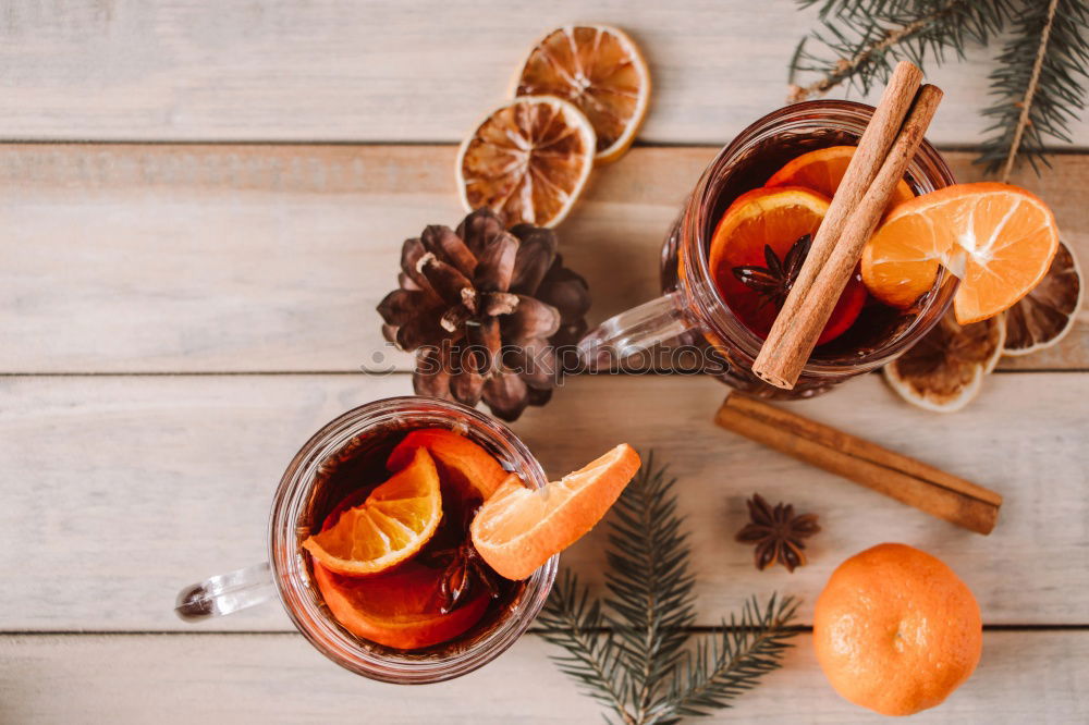 carrot juice with a glass jar on a wooden surface