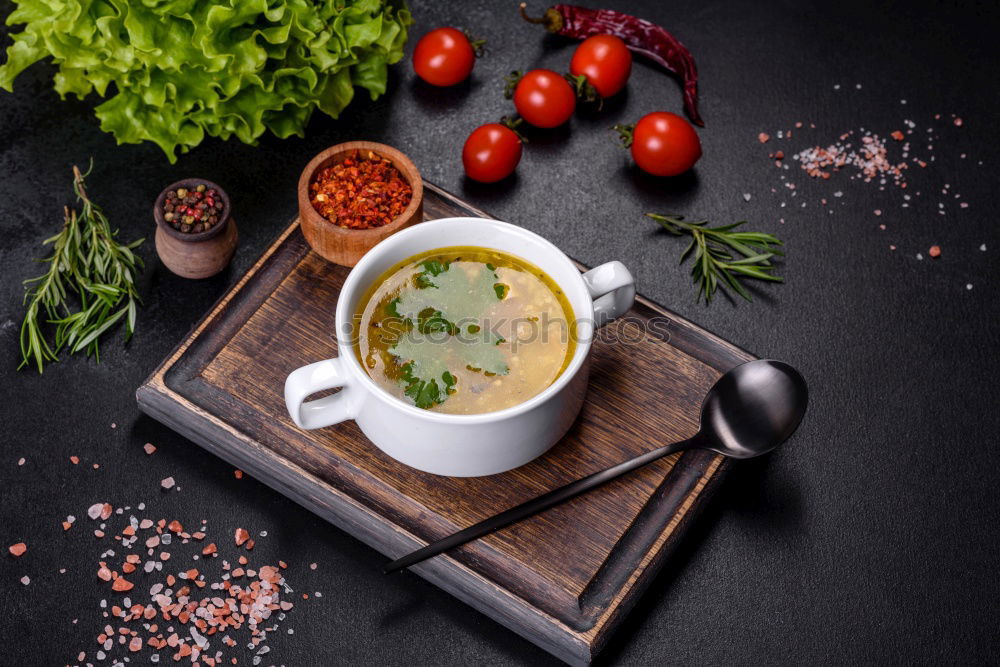 Pumpkin soup on the plate and salad