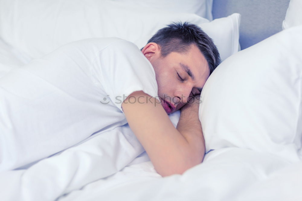 Similar – Young man sleeping with his dog