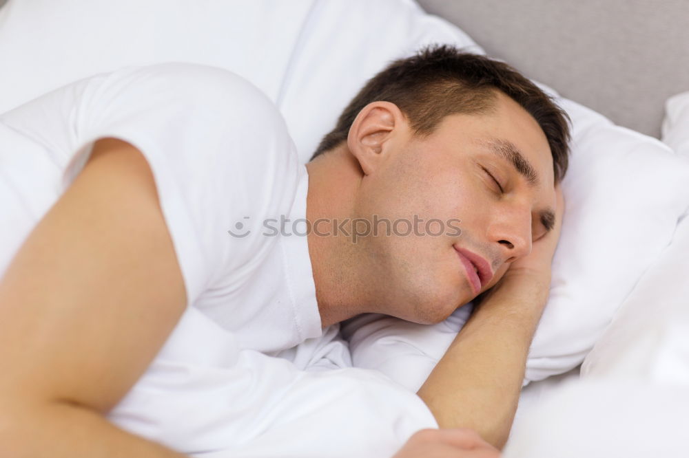 Similar – Young man sleeping with his dog