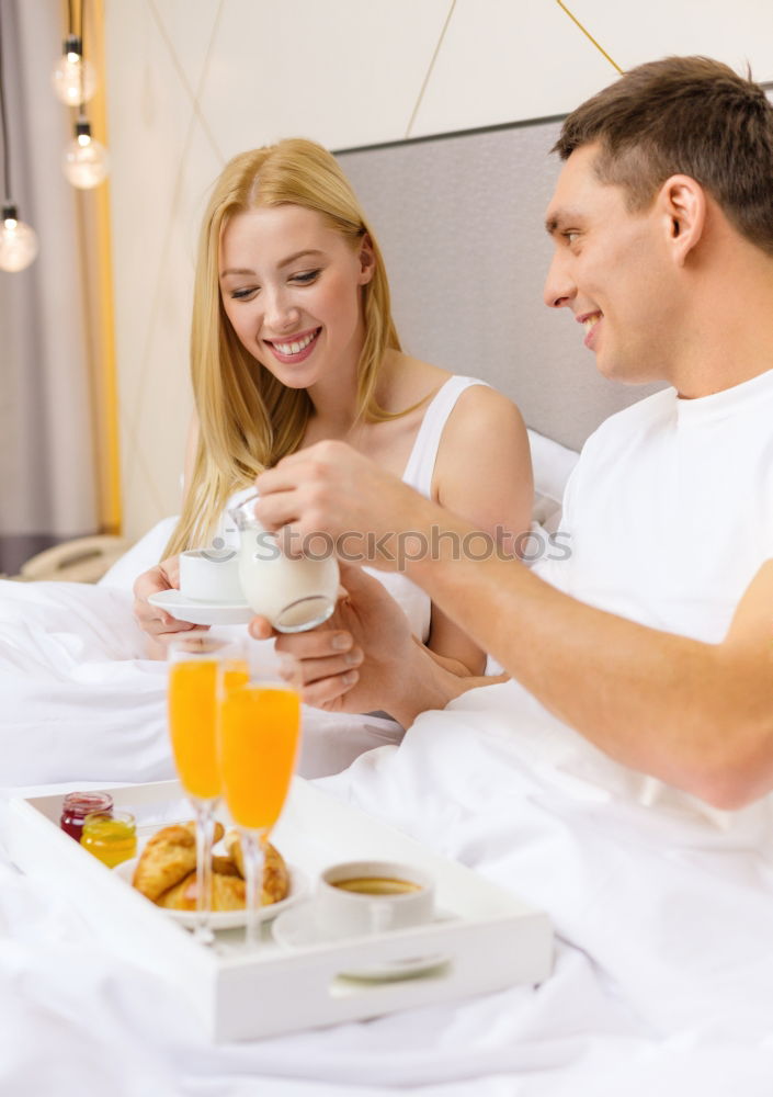 Similar – Image, Stock Photo Couple having breakfast in hotel