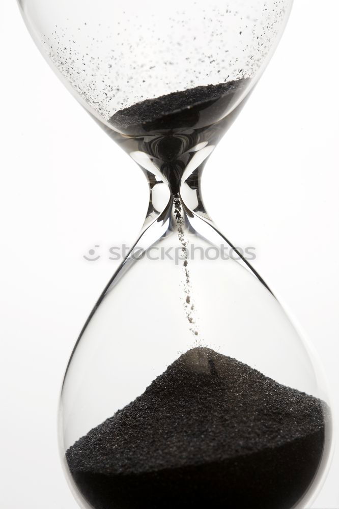 Similar – Hourglass with black sand running out