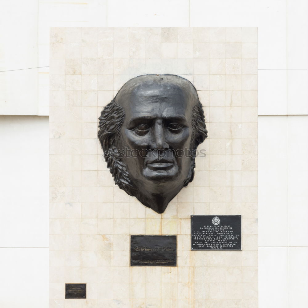 Image, Stock Photo male senior with silver-grey curls, glasses and three-day beard sitting in front of the Karl Marx monument in Chemitz