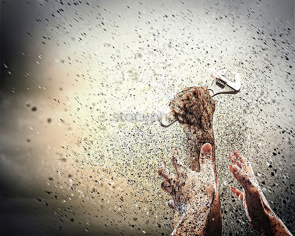 Similar – Whoosh!!! There thunders the dark car full through a deep puddle. A huge shower of water drenches the pedestrian with a colorful umbrella and red rubber boots.