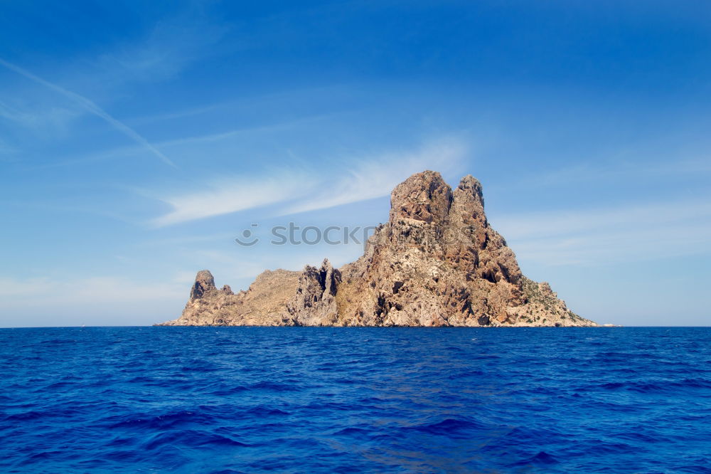 Similar – Rugged coast in the blue sea