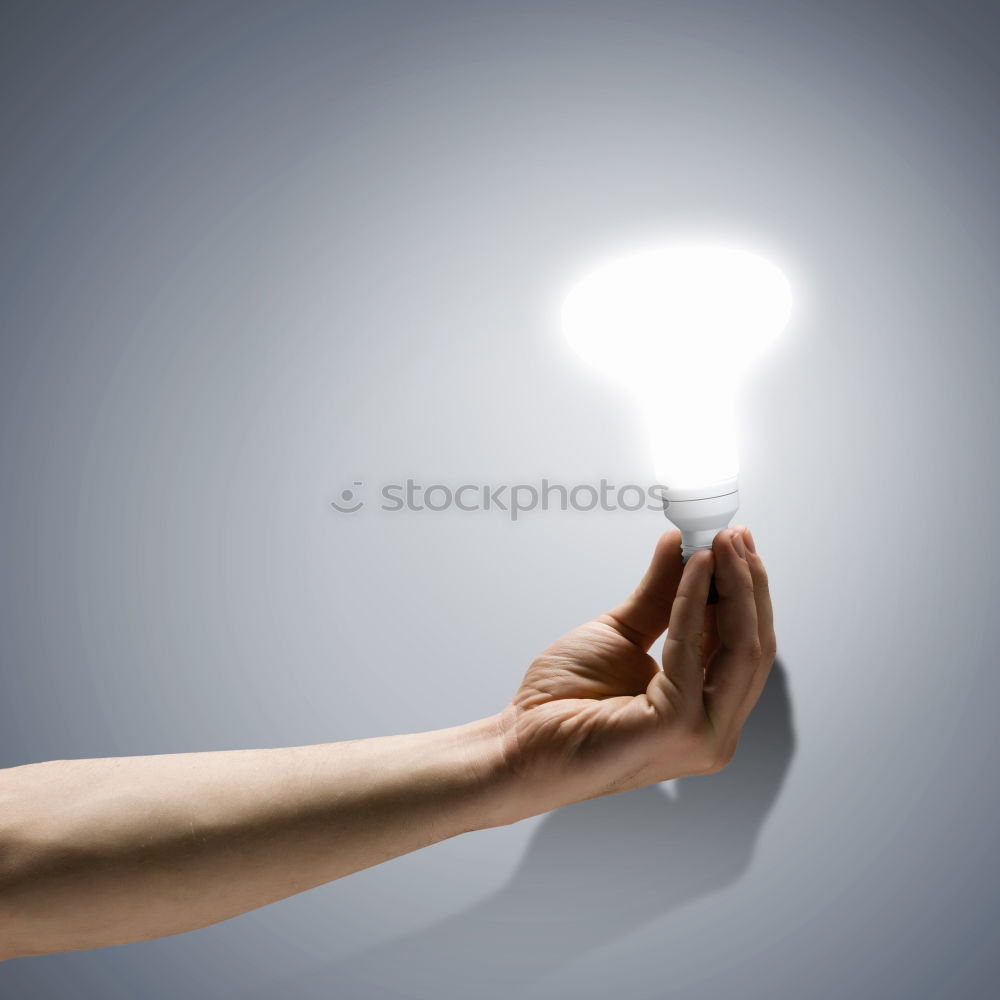 Similar – Female hand holding a shining light bulb, Great idea, innovation and inspiration, business concept background