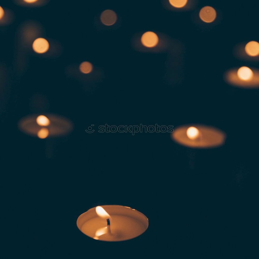 Similar – Image, Stock Photo Burning candle in a hand. Weak depth of field with blue background and some shine.