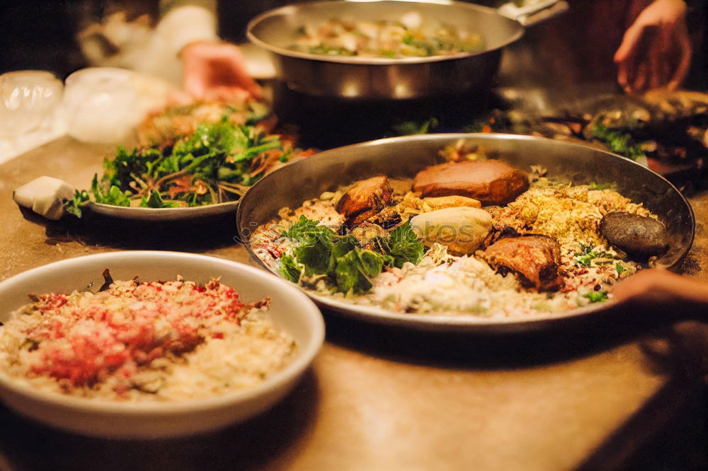 Similar – Korean hot pot and people taking food with chopsticks.