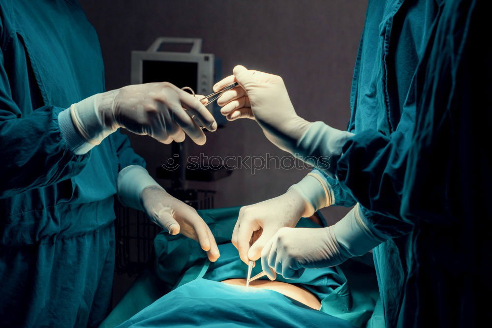 Similar – Image, Stock Photo Team of Surgeons Operating.