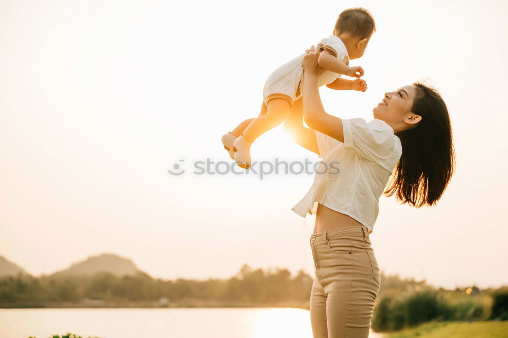 Image, Stock Photo Mother with child in park