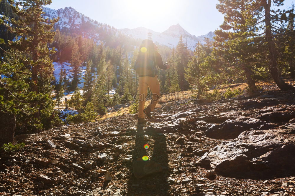 Similar – Woman walks and looks into the mountains