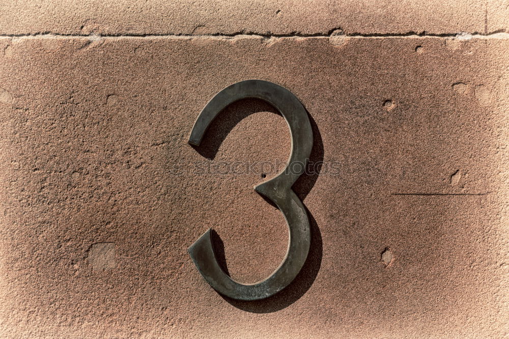 Similar – House number 37 on a dark wooden front door with crooked hook