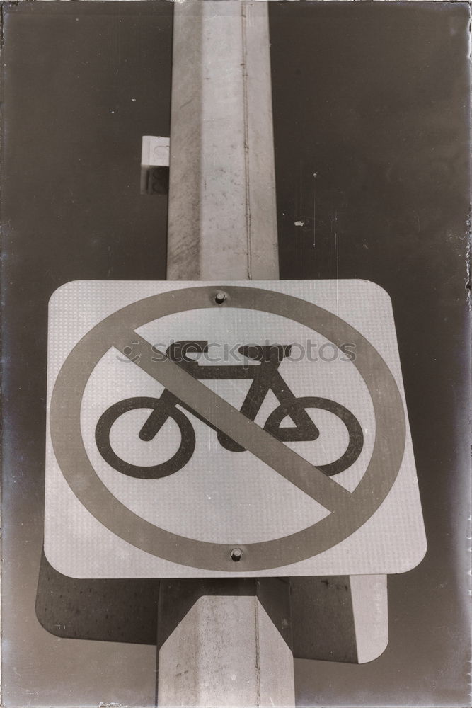 Similar – Signs I In front of a yellow house on the left and right side of the road there are traffic signs