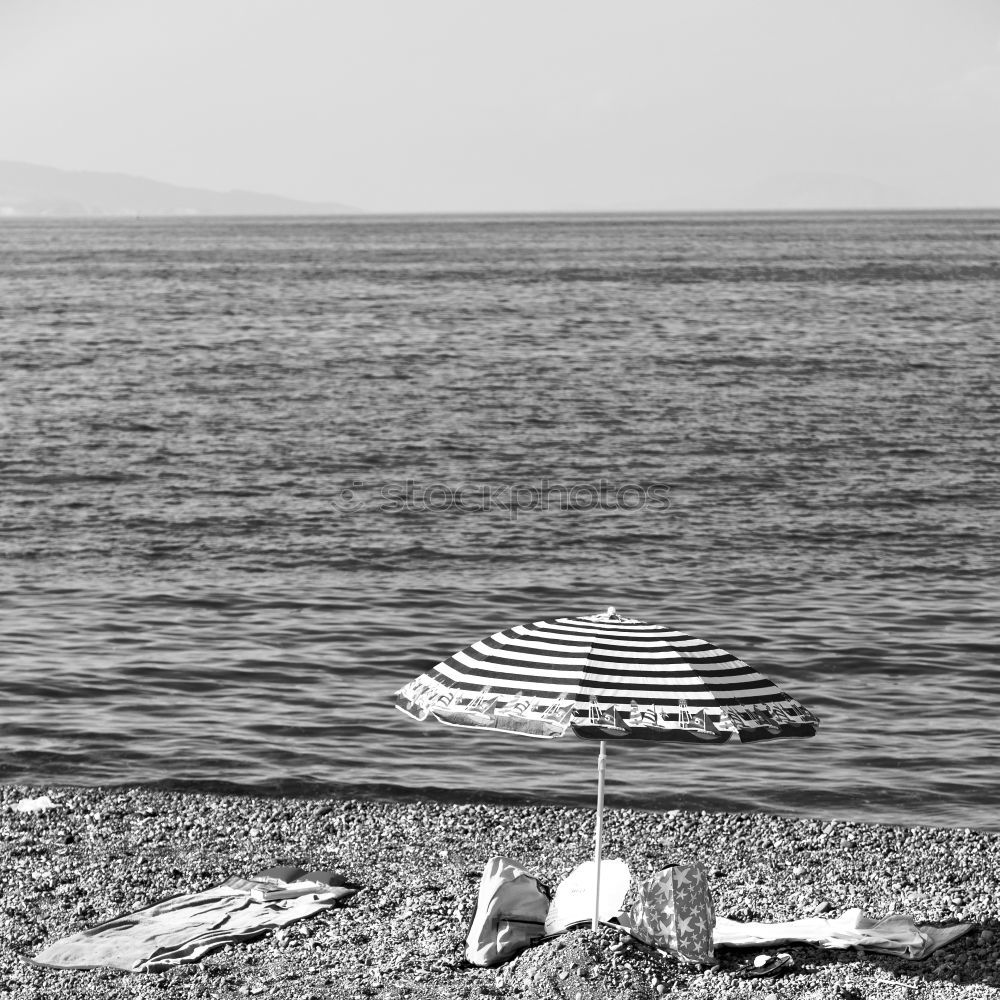 Similar – Frau blickt von der Promenade auf das Meer