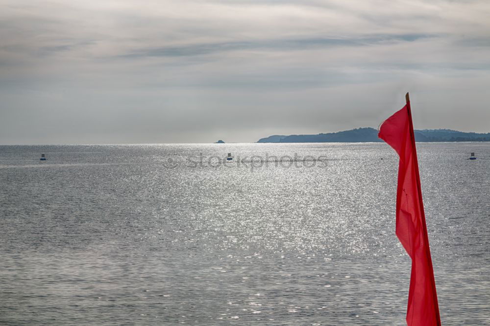 Similar – Fishing flags, sea, jetty