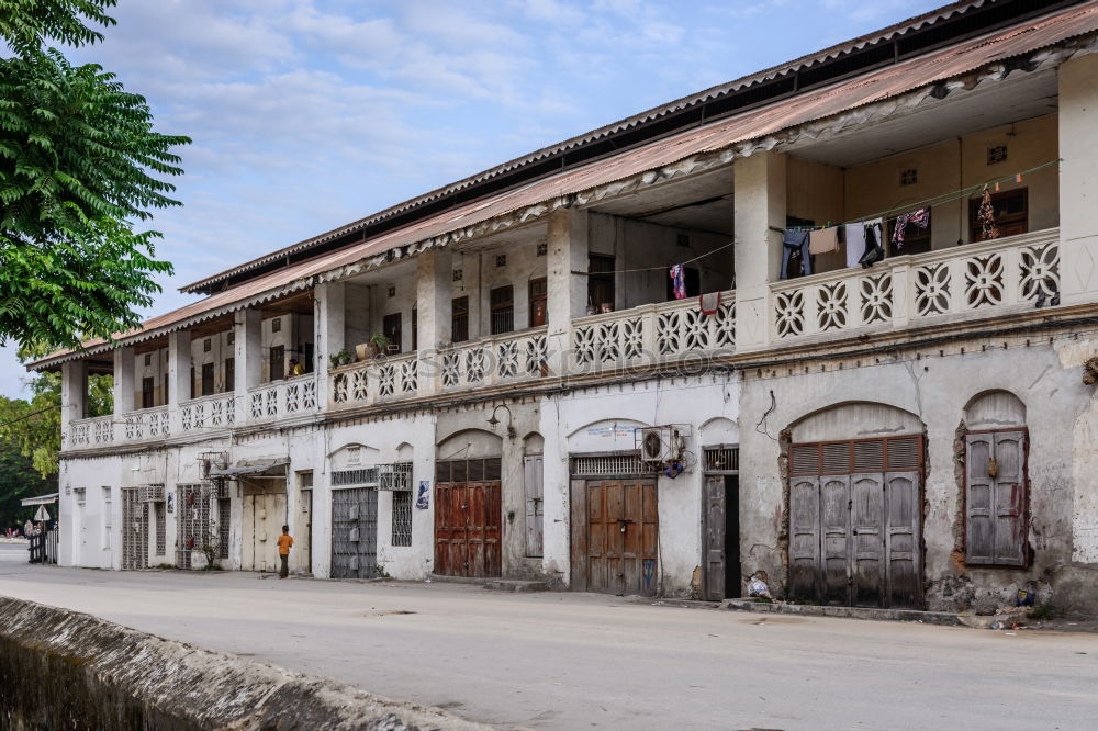 Similar – a house in the middle of the street