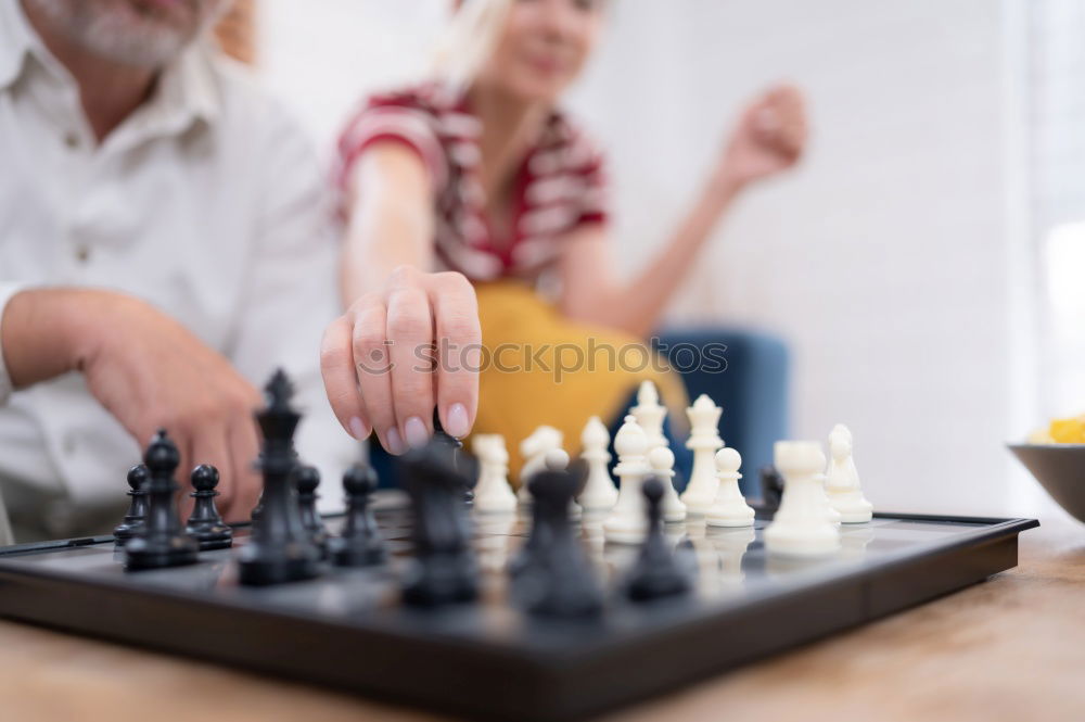 Similar – child girl playing checkers with dad